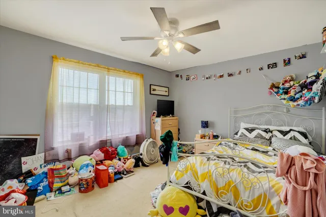 a bed room with a bed and a window