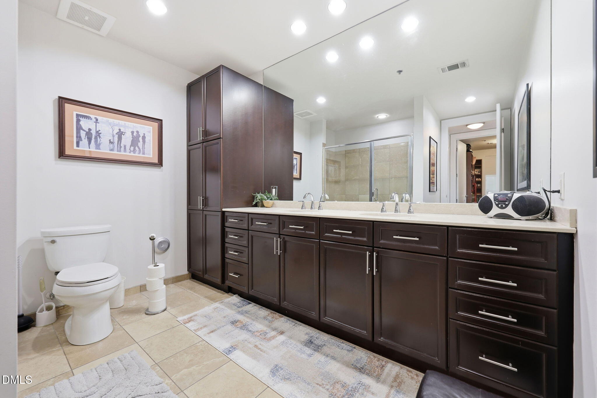 618 North Boylan Avenue, Unit 718 Raleigh, NC 27603 - Photo 13 of 38 a bathroom with a sink a toilet and a mirror