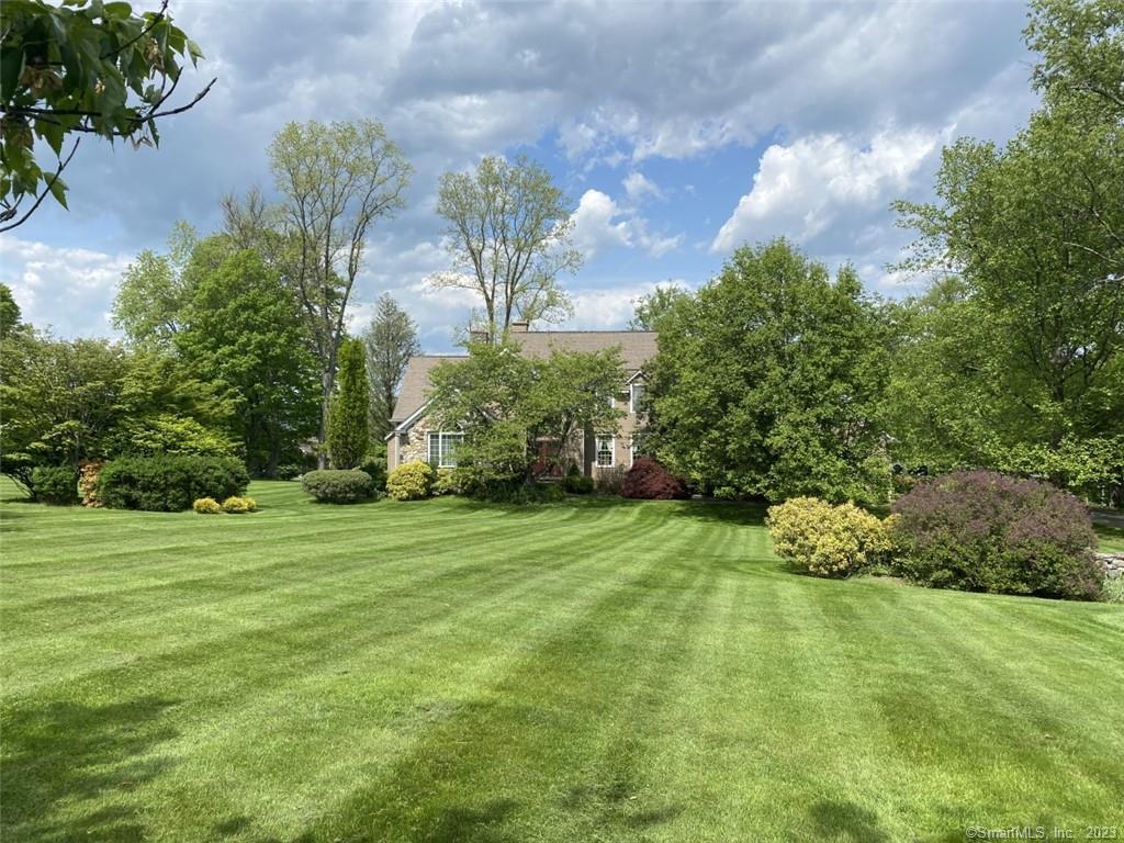a backyard of a house with lots of green space