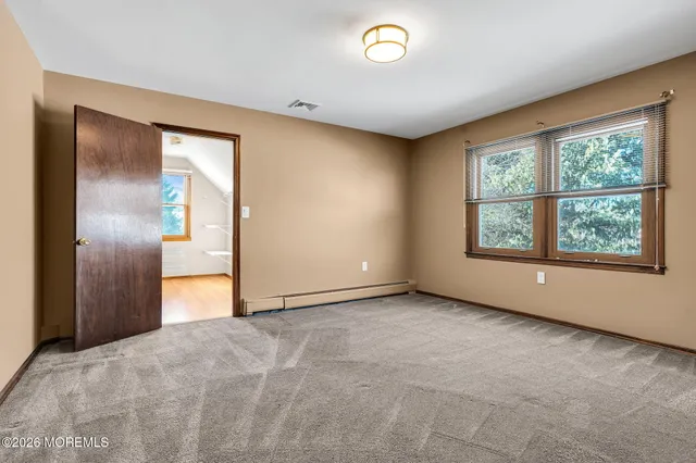 an empty room with large window