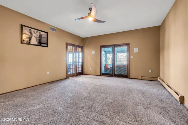 a view of empty room with windows