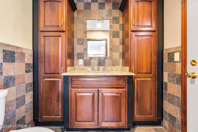 a bathroom with windows and a bath tub