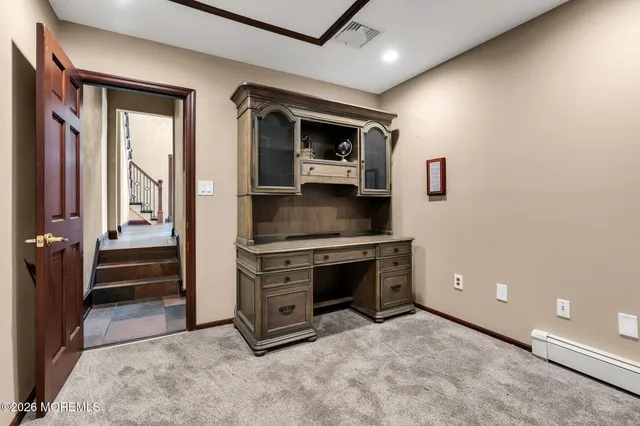 a view of room with window and flat screen tv
