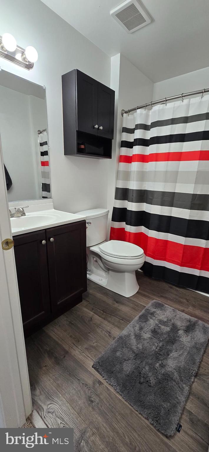 206 Crider Avenue Moorestown, NJ 08057 - Photo 17 of 20 a room with a flat screen tv and cabinets