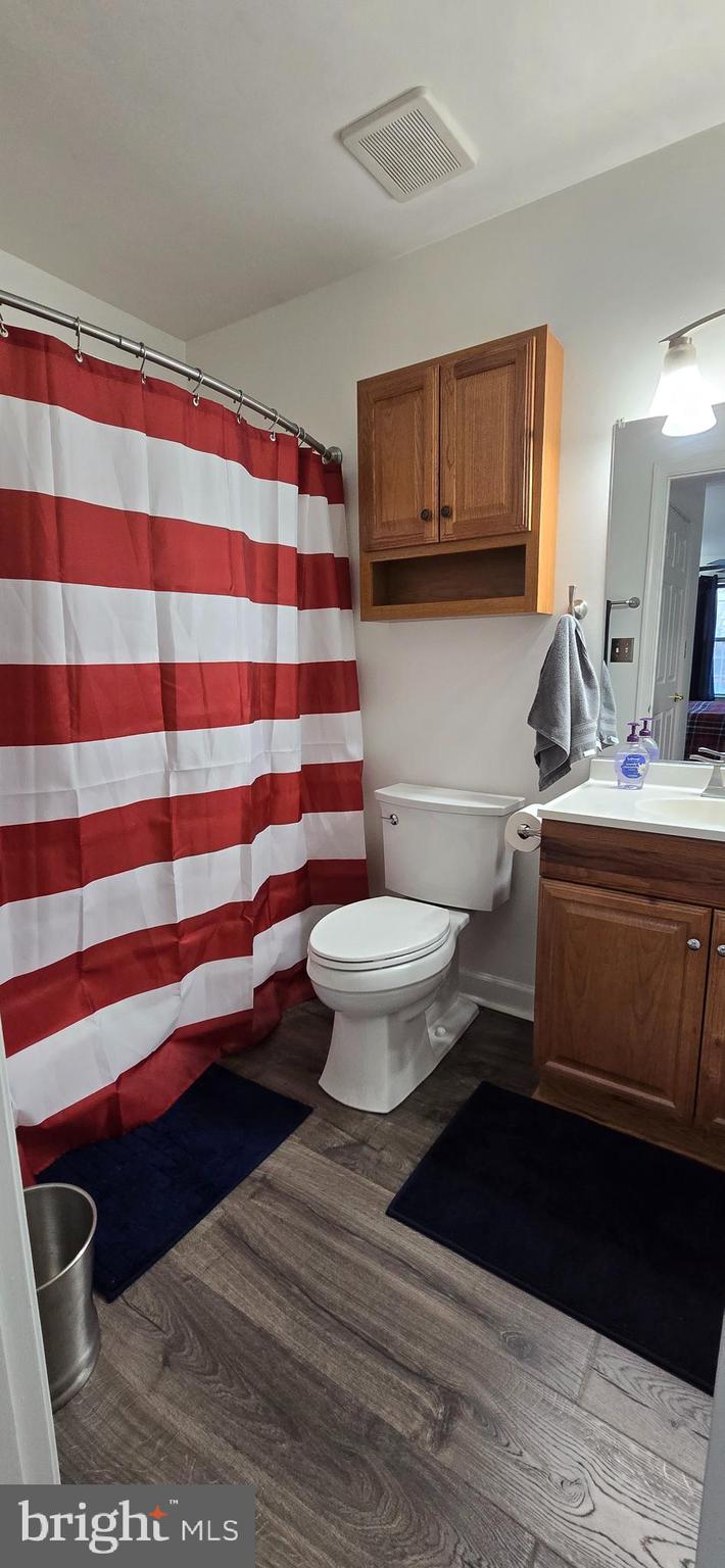 206 Crider Avenue Moorestown, NJ 08057 - Photo 20 of 20 a bathroom with a sink toilet and mirror