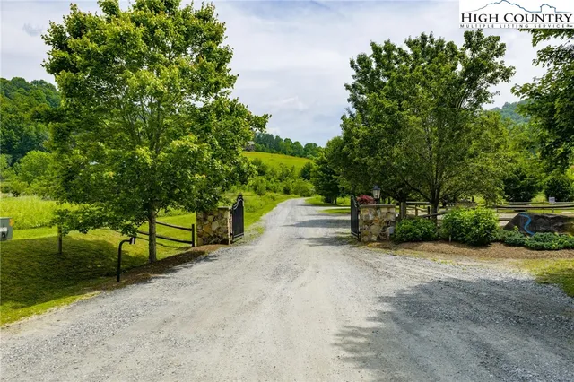 a view of street with wooden fence