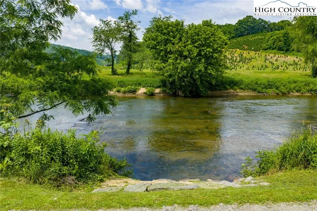 a view of a lake with a yard
