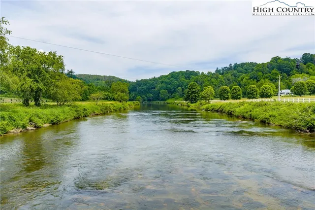 a view of a lake with a big yard