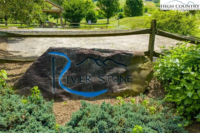 a view of swimming pool with a yard and sitting area