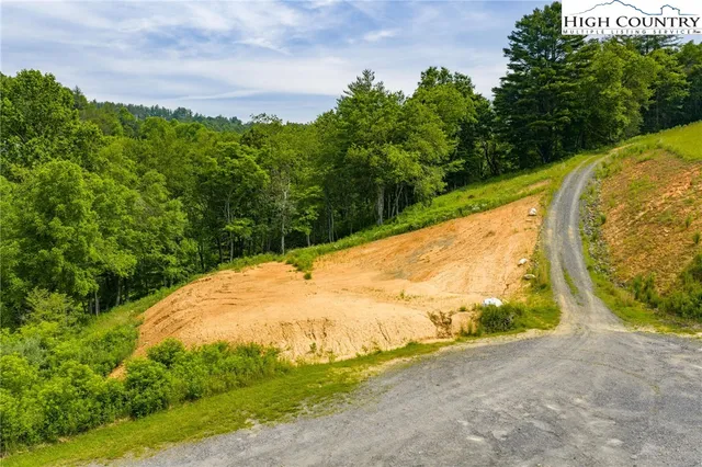 a view of a swimming pool with a yard