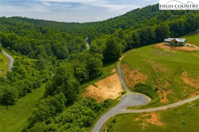 a view of a swimming pool with a yard