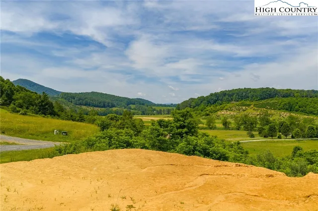 a view of a pathway with a yard
