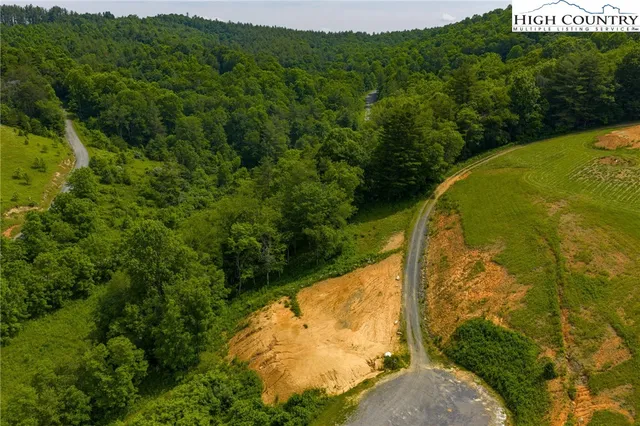 a view of a swimming pool with a yard