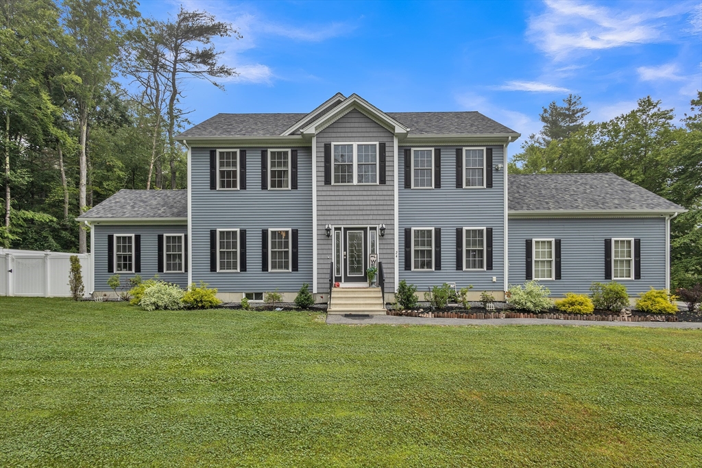 24 Old County Road Ashburnham, MA 01430 - Photo 1 of 32 a front view of a house with a garden