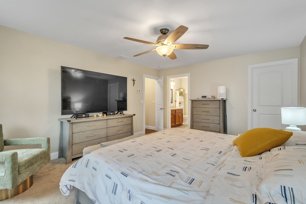24 Old County Road Ashburnham, MA 01430 - Photo 13 of 32 a bedroom with a bed and a flat screen tv