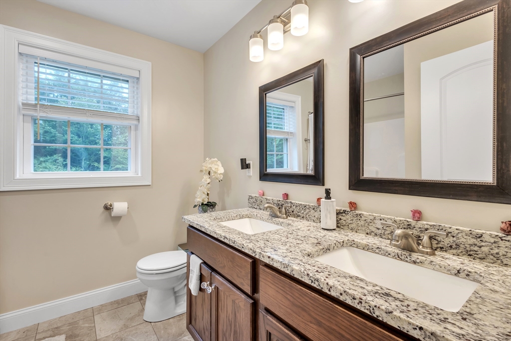 24 Old County Road Ashburnham, MA 01430 - Photo 17 of 32 a bathroom with a granite countertop sink and a mirror