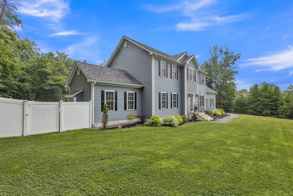 24 Old County Road Ashburnham, MA 01430 - Photo 2 of 32 a view of a house with a yard and sitting area