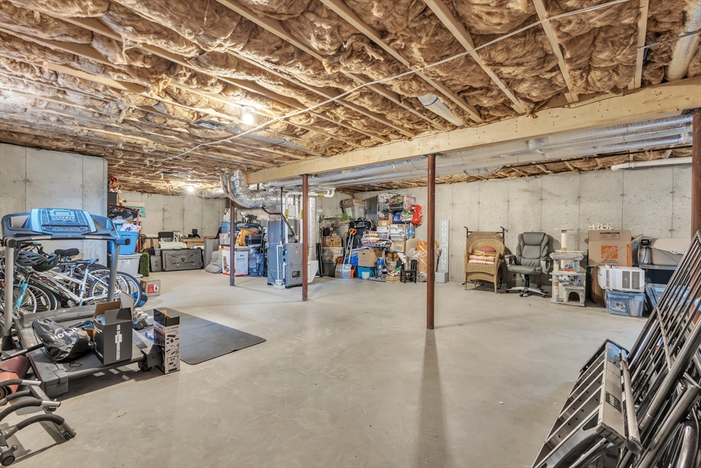 24 Old County Road Ashburnham, MA 01430 - Photo 24 of 32 a view of a garage with a bike and car