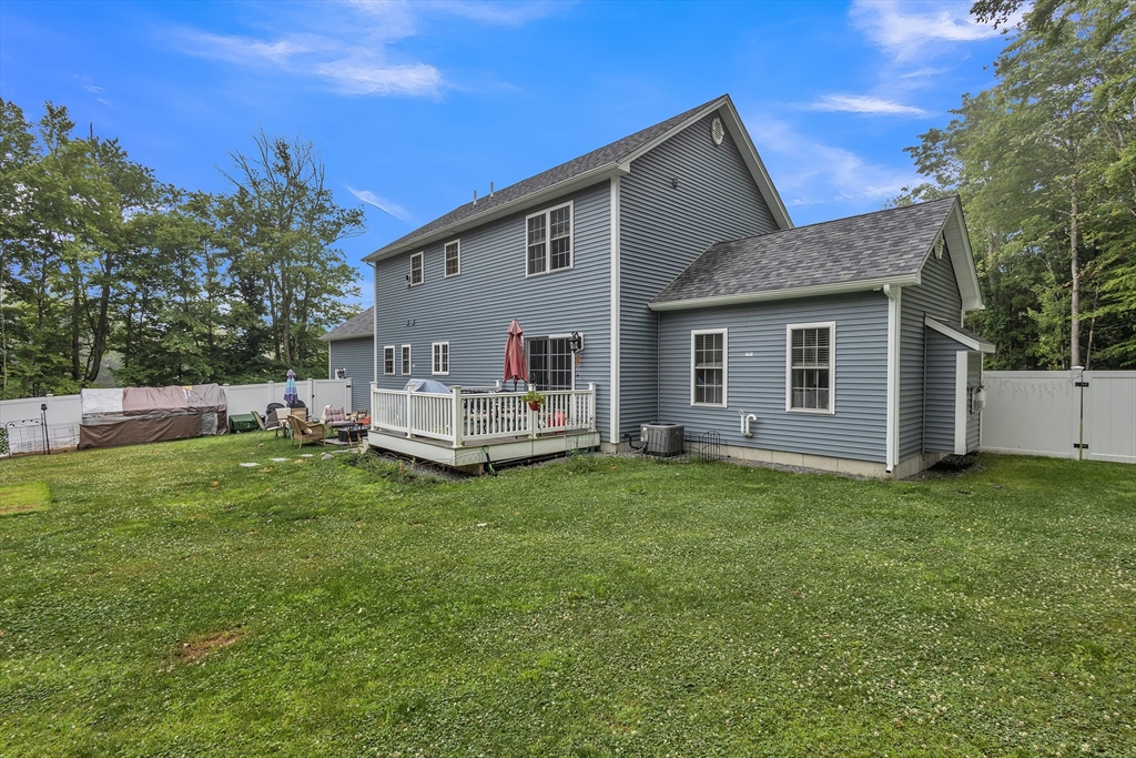 24 Old County Road Ashburnham, MA 01430 - Photo 27 of 32 a backyard of a house with table and chairs