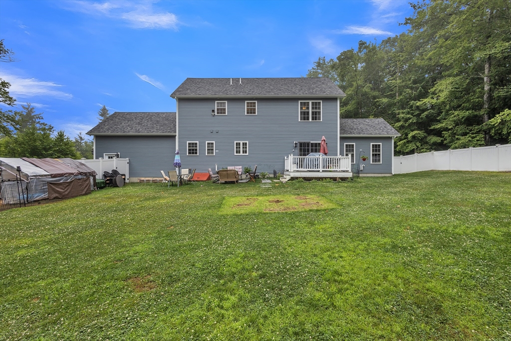 24 Old County Road Ashburnham, MA 01430 - Photo 28 of 32 a front view of house with yard and trees in the background