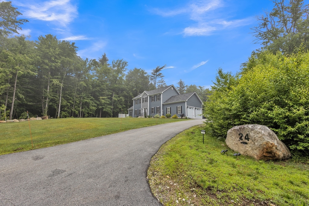 24 Old County Road Ashburnham, MA 01430 - Photo 3 of 32 a view of a house with a backyard