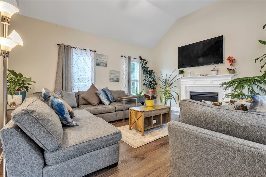 24 Old County Road Ashburnham, MA 01430 - Photo 8 of 32 a living room with furniture a flat screen tv and a fireplace