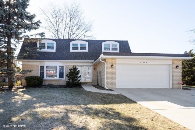 546 North Rohlwing Road Palatine, IL 60074 - Photo 1 of 17 a front view of a house with a yard