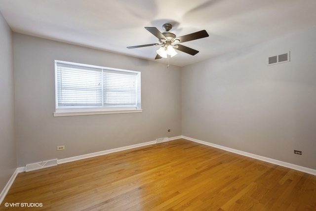 546 North Rohlwing Road Palatine, IL 60074 - Photo 11 of 17 a view of an empty room with a window
