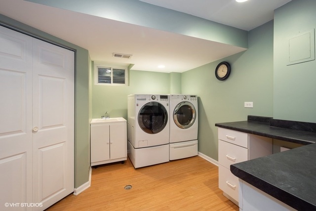 546 North Rohlwing Road Palatine, IL 60074 - Photo 15 of 17 a utility room with sink dryer and washer