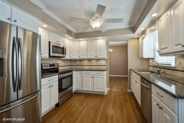 546 North Rohlwing Road Palatine, IL 60074 - Photo 3 of 17 a kitchen with stainless steel appliances granite countertop a refrigerator a stove top oven a sink and dishwasher
