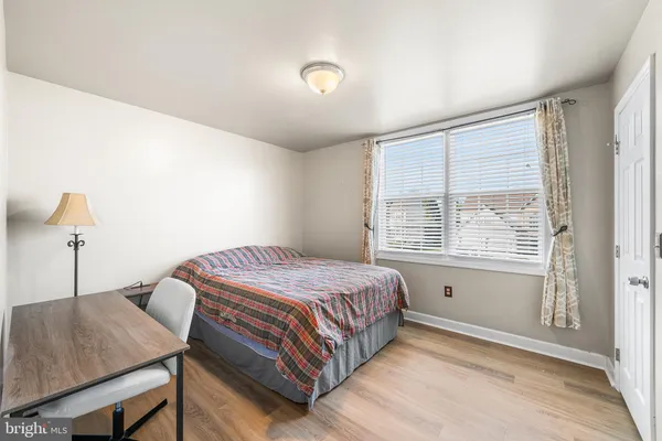a bedroom with a bed and a table