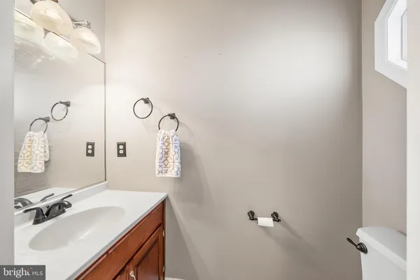a bathroom with a sink and mirror