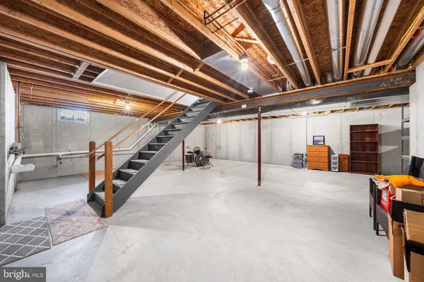 a view of an empty room with stairs