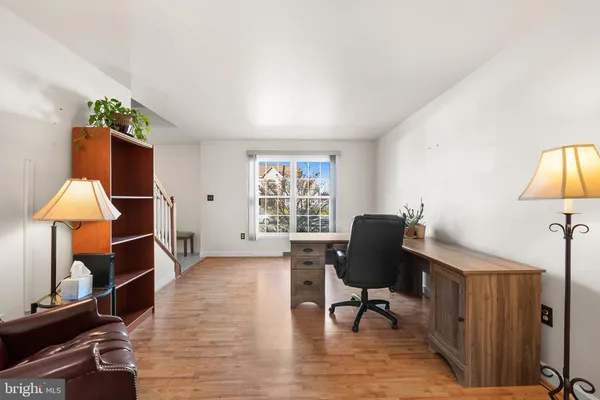 a workspace with furniture and a window