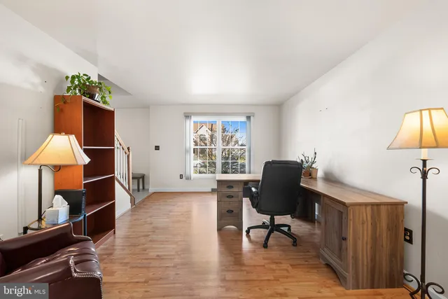 a workspace with furniture and a window