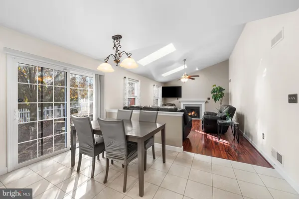 a view of a dining room with furniture and a livingroom