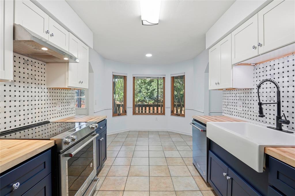 10808 Northwest 31st Place Gainesville, FL 32606 - Photo 16 of 38 a kitchen with a sink appliances and cabinets