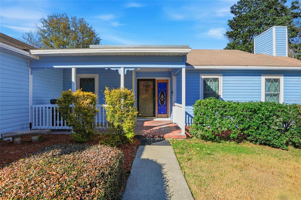 10808 Northwest 31st Place Gainesville, FL 32606 - Photo 2 of 38 a front view of a house with garden