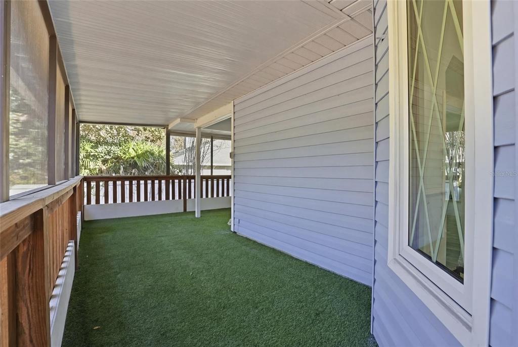10808 Northwest 31st Place Gainesville, FL 32606 - Photo 26 of 38 a view of a porch with a yard