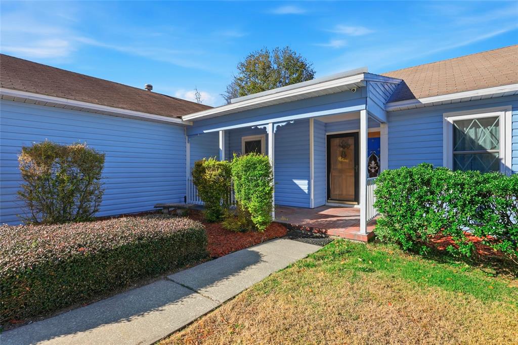 10808 Northwest 31st Place Gainesville, FL 32606 - Photo 3 of 38 a front view of a house with garden