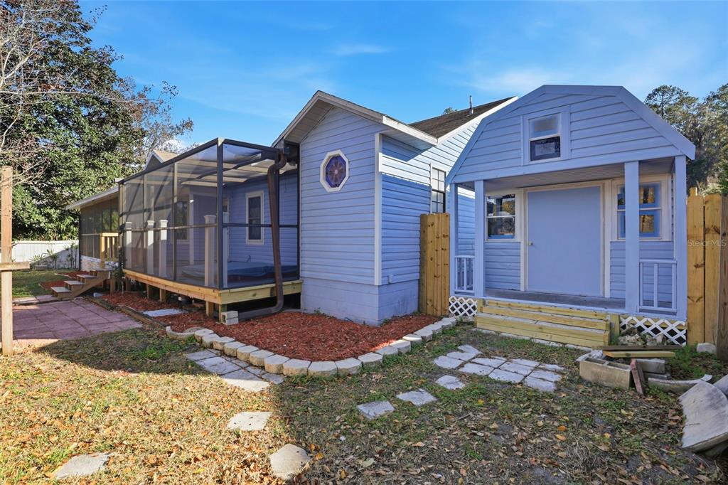10808 Northwest 31st Place Gainesville, FL 32606 - Photo 32 of 38 a view of a small house with wooden fence
