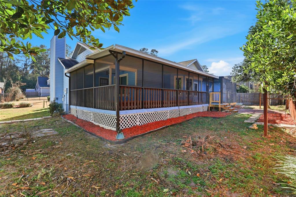 10808 Northwest 31st Place Gainesville, FL 32606 - Photo 33 of 38 a view of backyard with green space