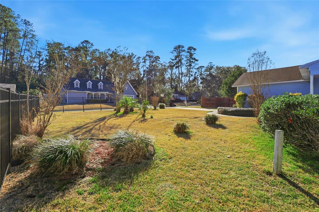 10808 Northwest 31st Place Gainesville, FL 32606 - Photo 35 of 38 a view of a swimming pool with an outdoor space and seating area