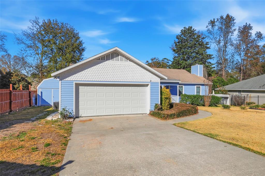 10808 Northwest 31st Place Gainesville, FL 32606 - Photo 36 of 38 a view of a house with a yard covered in snow