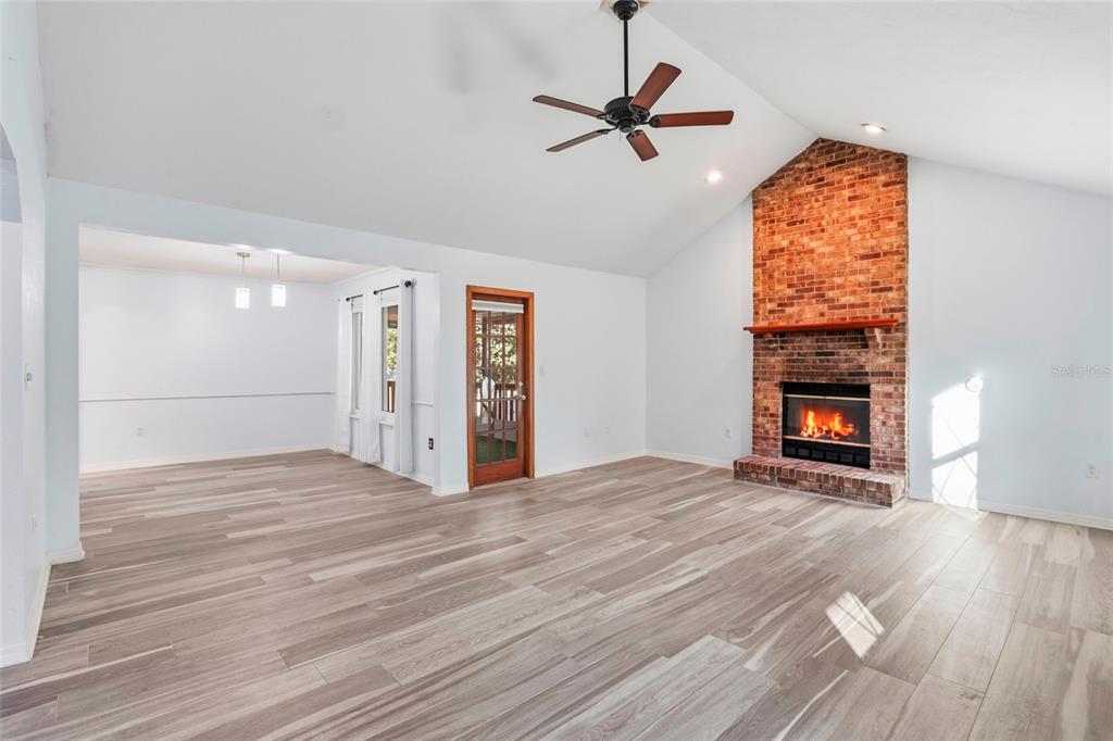 10808 Northwest 31st Place Gainesville, FL 32606 - Photo 9 of 38 a view of an empty room with a window and fireplace