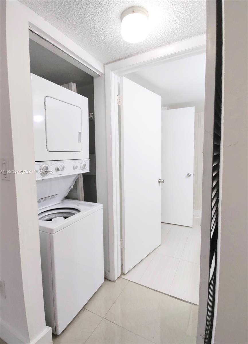 15500 Southwest 80th Street, Unit A105 Miami, FL 33193 - Photo 11 of 36 a utility room with dryer and washer