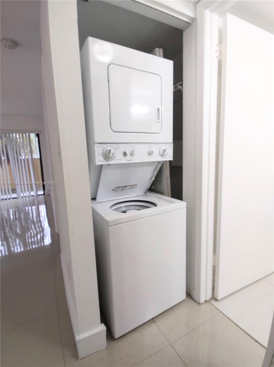 15500 Southwest 80th Street, Unit A105 Miami, FL 33193 - Photo 16 of 36 a utility room with dryer and washer