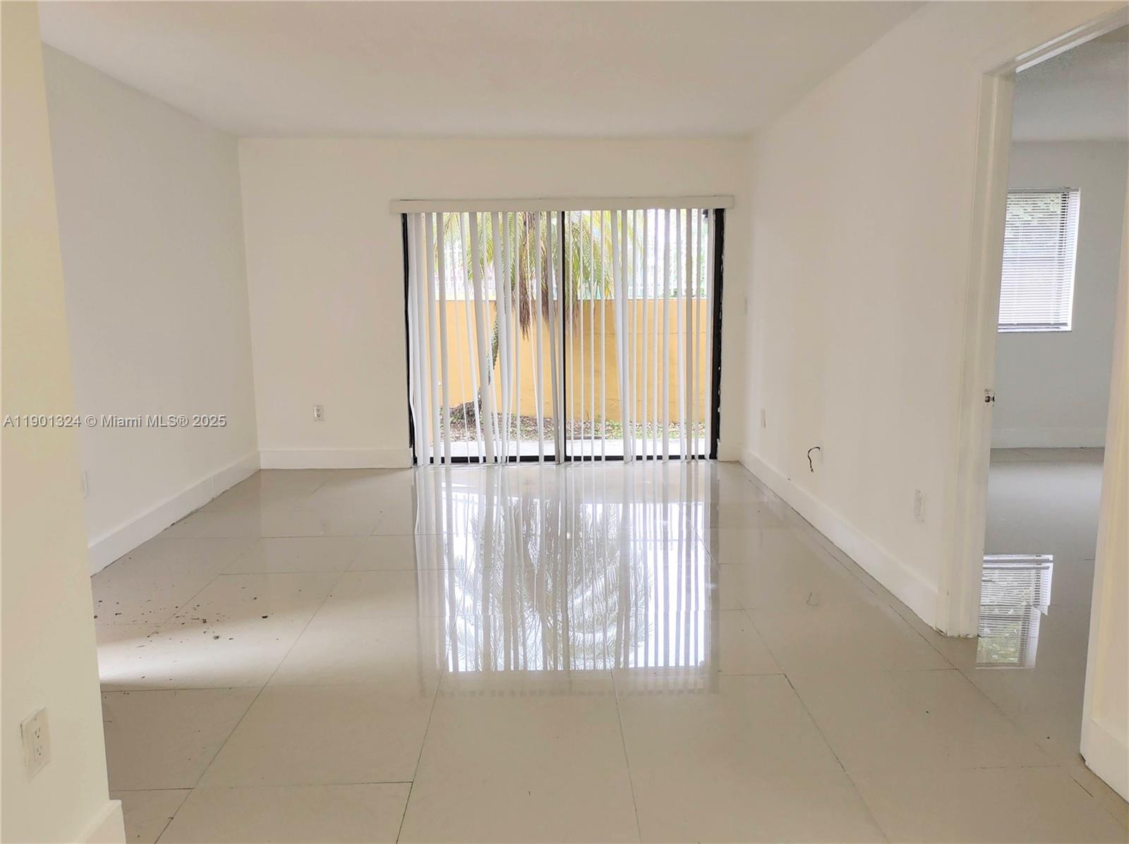 15500 Southwest 80th Street, Unit A105 Miami, FL 33193 - Photo 30 of 36 a view of entryway with wooden floor