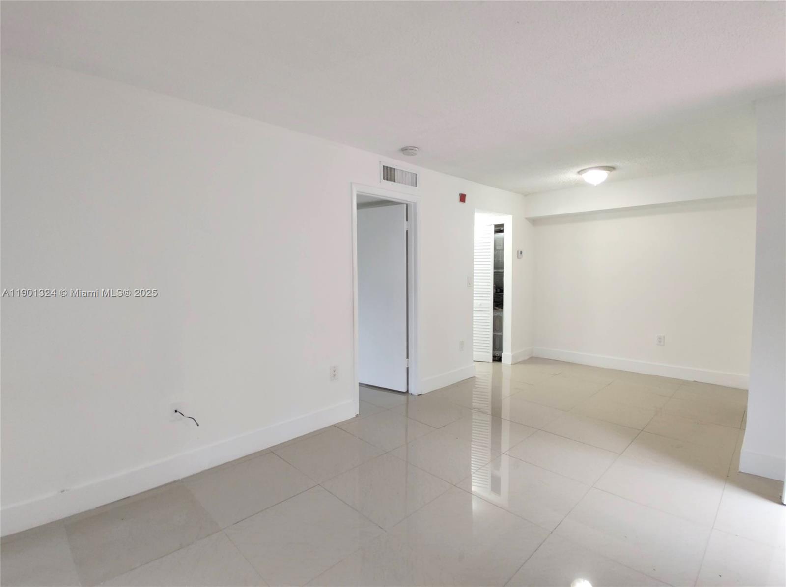 15500 Southwest 80th Street, Unit A105 Miami, FL 33193 - Photo 4 of 36 a view of an empty room