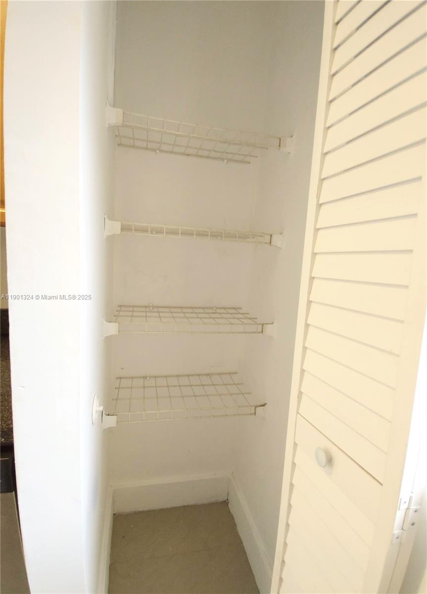 15500 Southwest 80th Street, Unit A105 Miami, FL 33193 - Photo 8 of 36 a bathroom with a bathtub